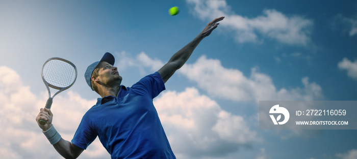 male tennis player hitting ball with racket against blue sky. banner copy space