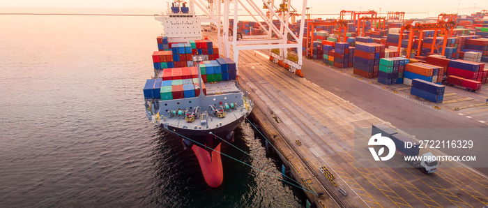 crane loanding cargo container to container ship in the international terminal yard port  concept smart freight shipping by ship at sunrise . truck working near sea  forwarder mast