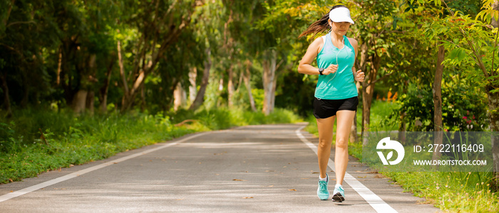 Asian wonman  in sport wear jogging  on raod at park