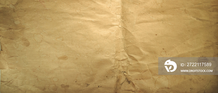 Rectangular photo of the texture of old yellowed paper. Vintage-style paper background for text.