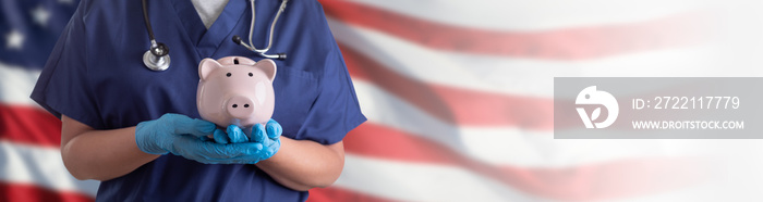 Doctor or Nurse Wearing Surgical Gloves Holding Piggy Bank Over American Flag Banner