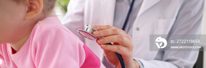 Little child with stethoscope at doctor reception.