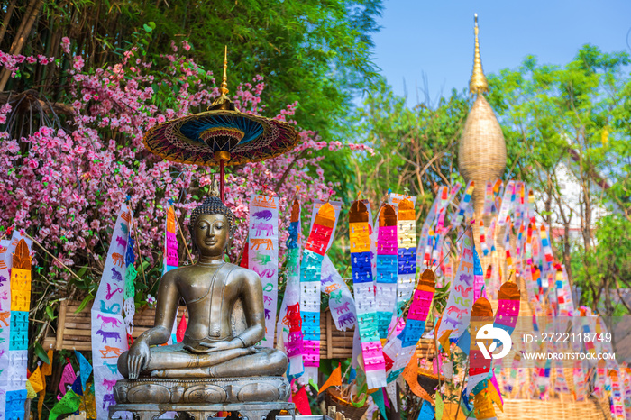 Prayer flags tung Hang with umbrella or Northern traditional flag hang on sand pagoda in the Phan Tao temple for Songkran Festival is celebrated in a traditional New Year’s Day in Chiang Mai,Thailand