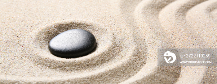 Stone on sand with lines. Zen concept