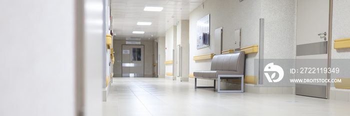 Empty hallway of a large building, hospital reception