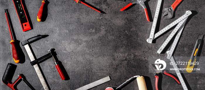 Tools lying on the concrete background, flat lay, top view