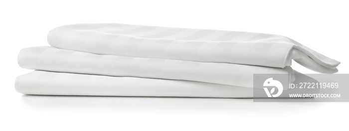 Stack of clean bed sheets on white background