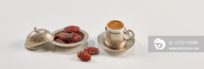 Ramadan date in the zinc plate turkish culture style with rosary and coffee.