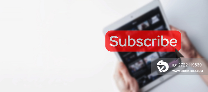 Subscribe button. Online video subscription red button. Internet service on laptop digital tablet blured banner background. Visual contents concept. Social networking service.