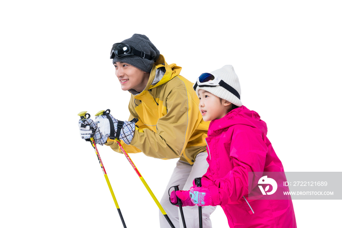 年轻爸爸和女儿滑雪