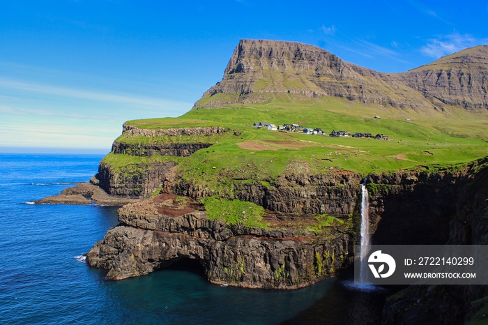 Múlafossur on Vagar Island, Faroe Islands on a beautiful day with clear sky in summer