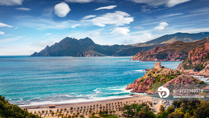 Exciting spring cityscape of Porto town with Genoise de Porto Ota tower. Dramatic morning view of Corsica island, France, Europe. Great Mediterranean seascape. Traveling concept background.