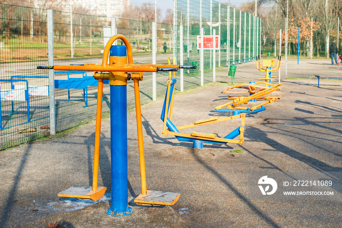 Outdoor gym in the public garden. Outdoor fitness equipment in public park. Sports simulators in the park