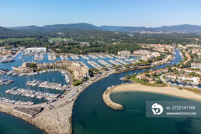 Aerial view on Gulf of Saint-Tropez, sail boats, houses of Port Grimaud and Port Cogolin, summer vacation in Provence, France