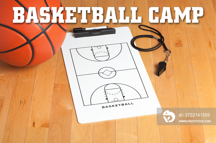 Basketball camp letters on background of wooden floor with clipb