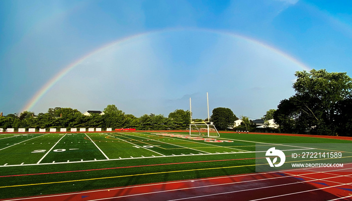 Rainbow over a high school athletic field