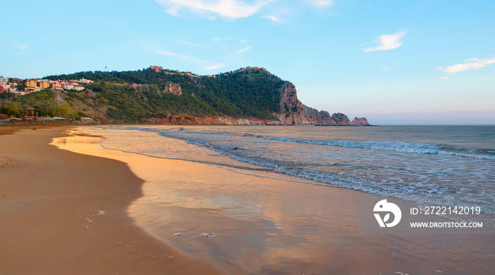 Cleopatra sand beach among rocks on evening sunset - Alanya, Turkey