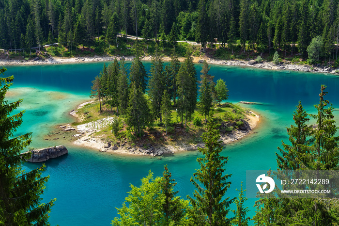 The lake Caumasee with its idyllic island is located in the southern part of the municipality of Flims in the Swiss canton of Graubunden.