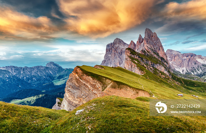Amazing Dolomites Mountains Landscape during sunset. View of Seceda During Colorful Sunset. Picturesque Sky over the Odle Group Mountains. Wonderful picturesque Scene. Val Gardena. Italy.