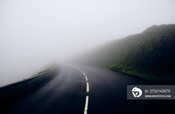 Fog on the road in the mountains. Sao Miguel Island, Azores.