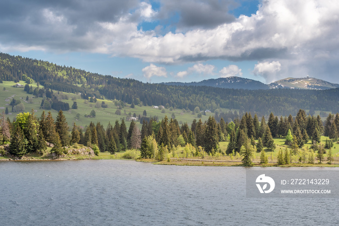 French landscape - Jura. View over the lake of Les Rousses in the Jura mountains (France) with the Mount La Dole (Switzerland) in the background.