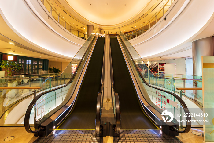 Escalator in the building of the business center, Straight stairs in the mall