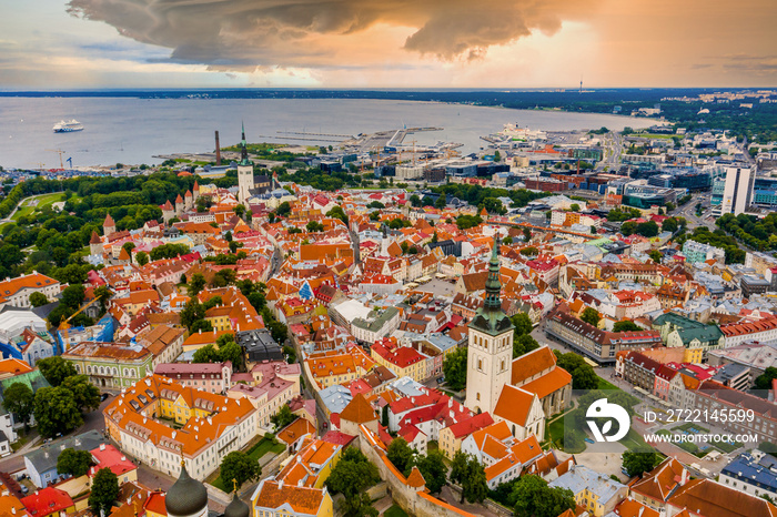 Amazing aerial drone shot of old town of Tallinn, Estonia at sunset