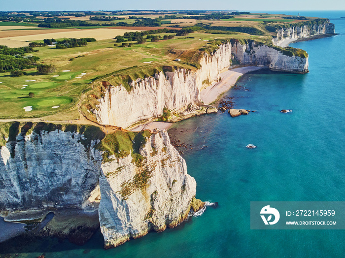 Picturesque landscape of white chalk cliffs and natural arches of Etretat, France