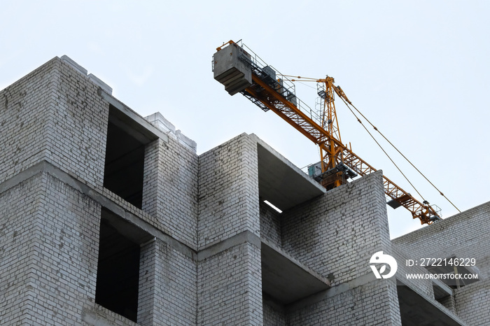 Building and Construction site of new home. New house under construction. House under construction at building site.