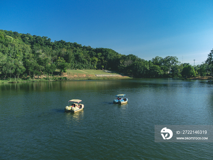 Unidentify tourists enjoying moment  in Hat yai Municipal Park, Songkhla, Thailand with lot activities such as pedal boat and picnic inside park area.