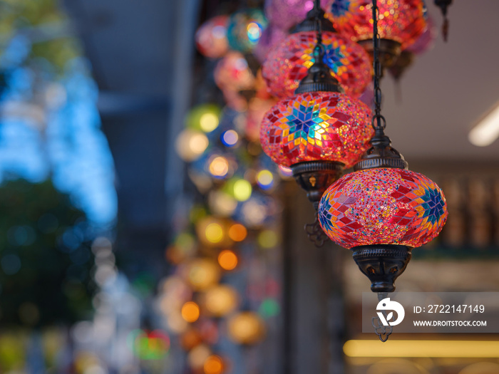 Colorful Turkish hanging lights of different colors and sizes. Turkish mosaic lambs. glass mosaic lamp in grand bazaar. Hand made mosaic vintage ottoman lambs and bokeh.