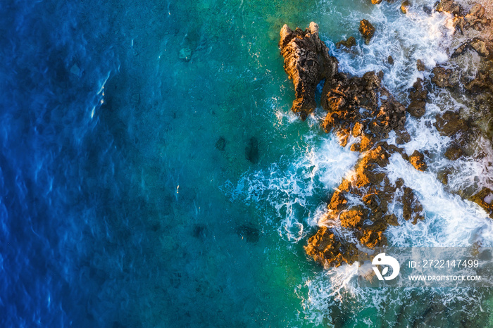 Mediterranean sea. Aerial view on the water and rocks during sunset. Vacation and adventure. Beach and blue water. Top view from drone at beach and azure sea.