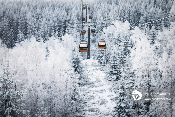 Gondolas rises in the mountains, ski resort, snow-covered Christmas trees, winter landscape