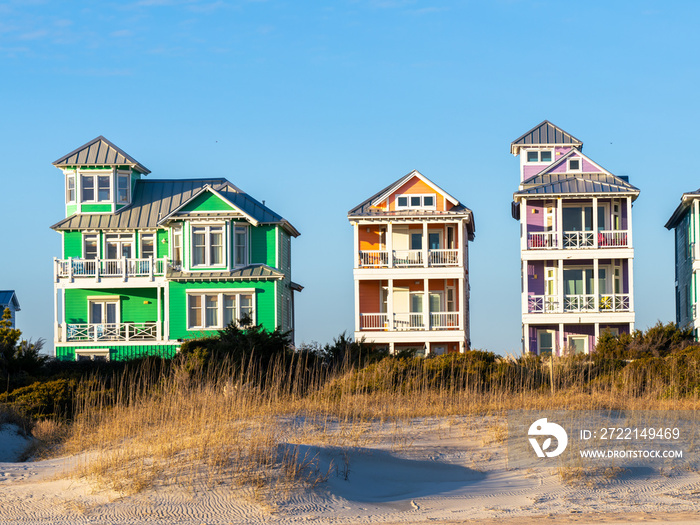 Colorful Beach Vacation Homes Behind Dunes Right at Sunset