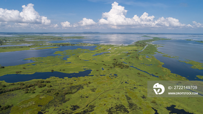 Aerial view panorama of Magdalena River landscape with blue sky and white clouds on a sunny day