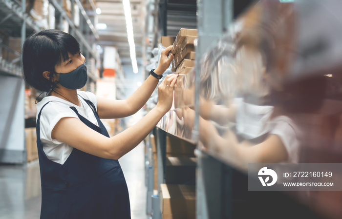 Asian Pregnant Woman in face mask shopping and choose product on shelf