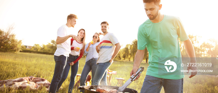 Friends at barbecue party on summer day