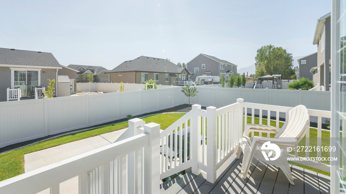 Pano Backyard wooden desk with a view of neighbors houses