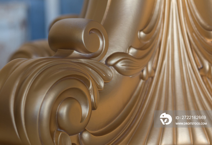 abstract background. carved pieces of furniture covered with gold paint. high-end luxury furniture i