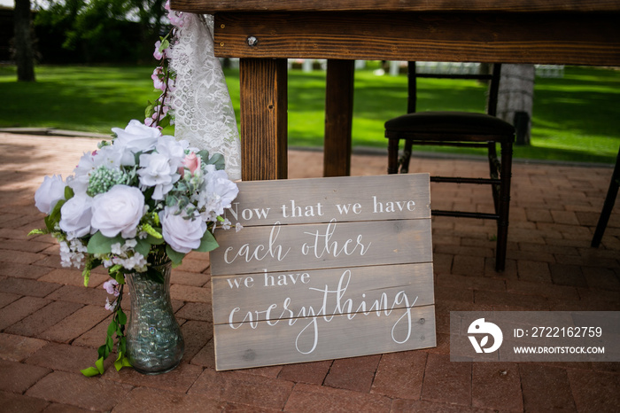 bouquet and sign at wedding reception