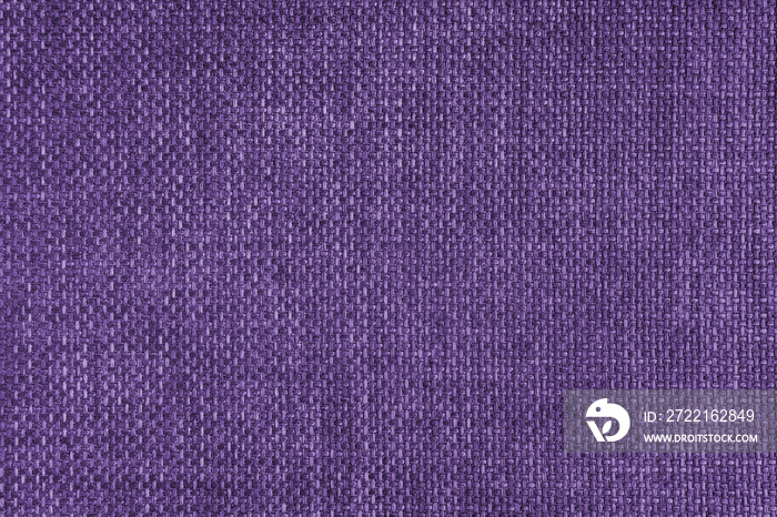 Jacquard woven upholstery, purple coarse fabric texture. Textile background, furniture textile mater