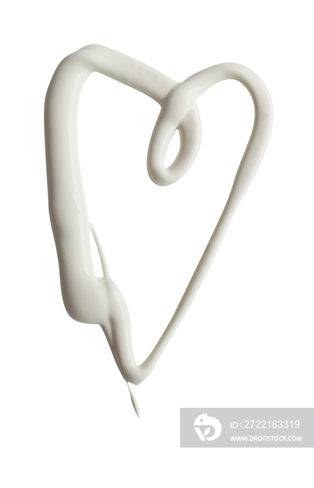 Heart shape made of white cream on a white background, can be used as mayonnaise too