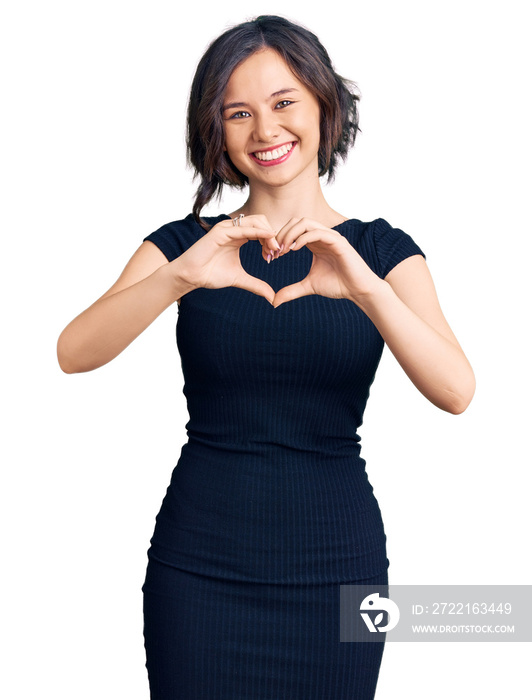 Young beautiful girl wearing casual clothes smiling in love showing heart symbol and shape with hand