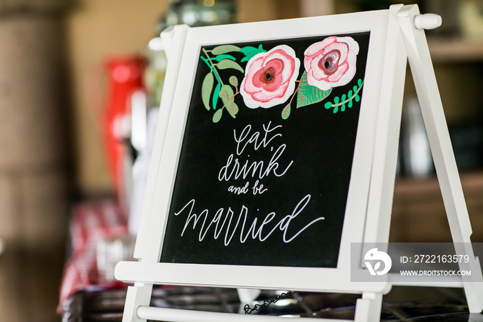 Eat drink and be married sign at wedding