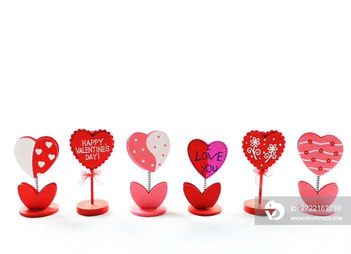 Heart shaped, happy Valentines Day note holder on isolated white background.