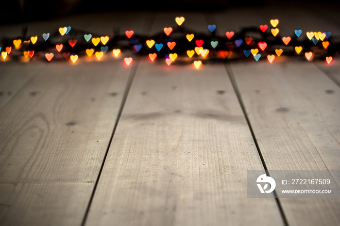 Heart bokeh, Valentines day concept on wooden background