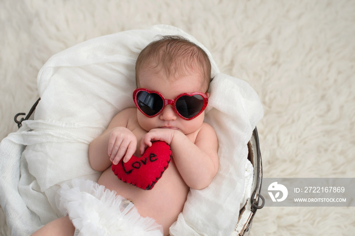 Newobrn Baby Girl with Heart Shaped Sunglasses