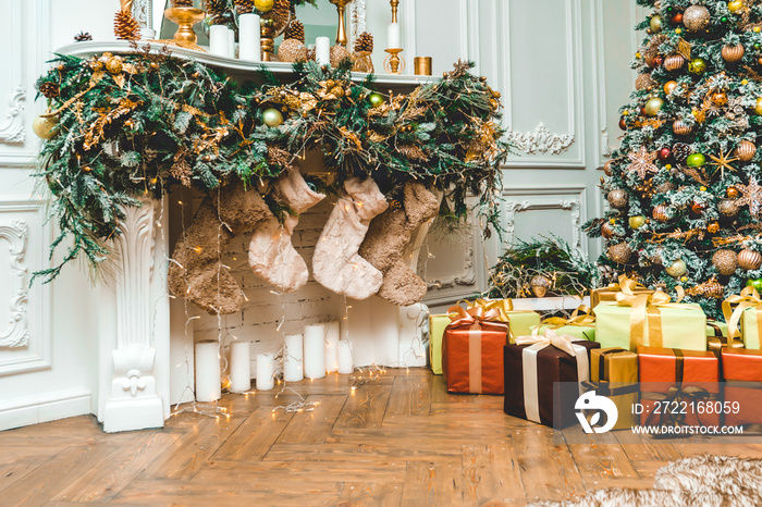 New Year s Eve decorated with toys green tree with gifts standing with fireplaces