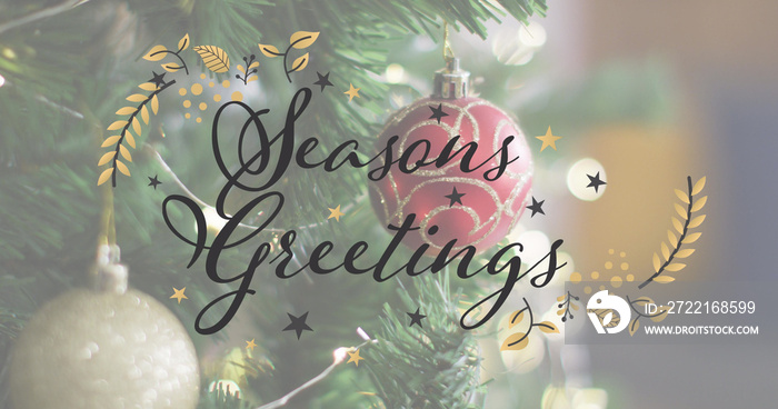 Image of seasons greetings text over christmas tree