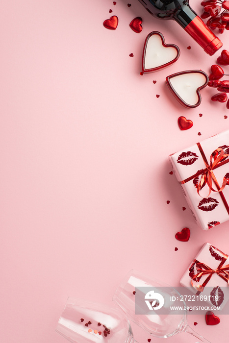 Valentines Day concept. Top view vertical photo of wine bottle glasses with confetti present boxes 